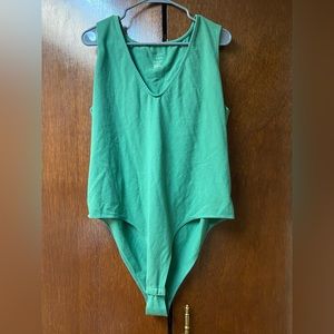 Women’s green body suit